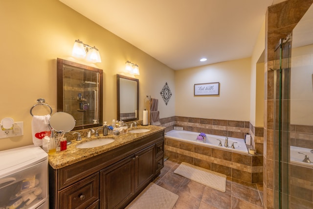 bathroom featuring vanity and separate shower and tub