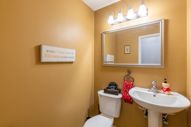 bathroom featuring sink and toilet