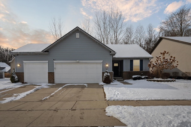 single story home featuring a garage