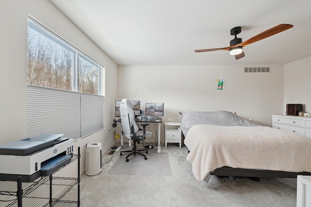 bedroom with light carpet and ceiling fan