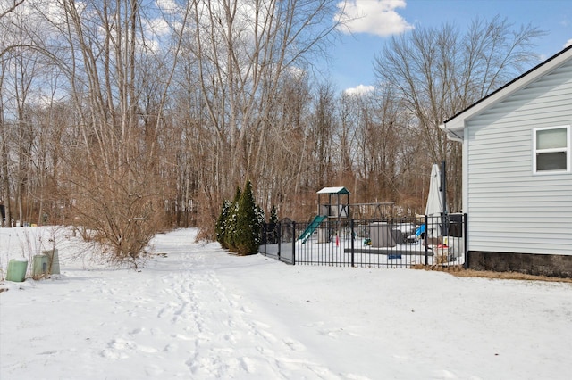 snowy yard with a playground