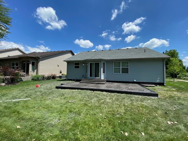 back of property with central AC unit, a patio area, and a lawn