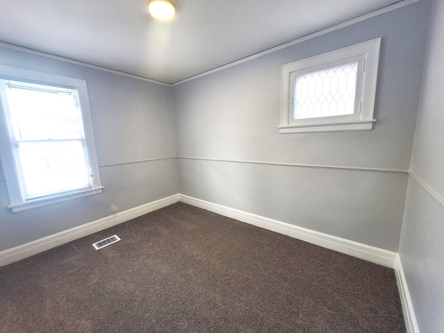 carpeted empty room with crown molding