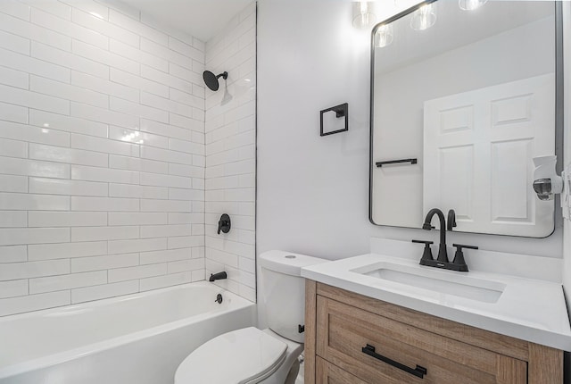 bathroom with tub / shower combination, toilet, and vanity