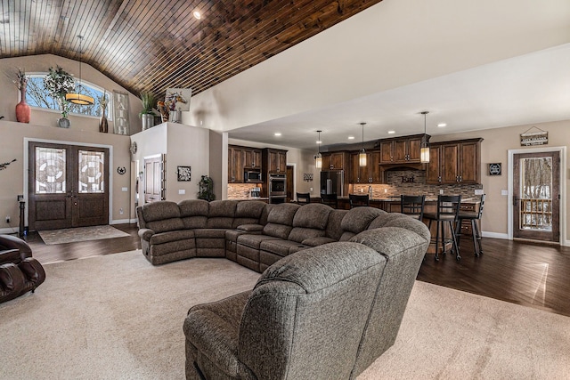 living area featuring high vaulted ceiling, baseboards, french doors, and dark wood-style flooring