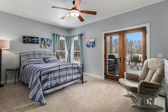 bedroom featuring multiple windows, french doors, access to outside, and carpet floors