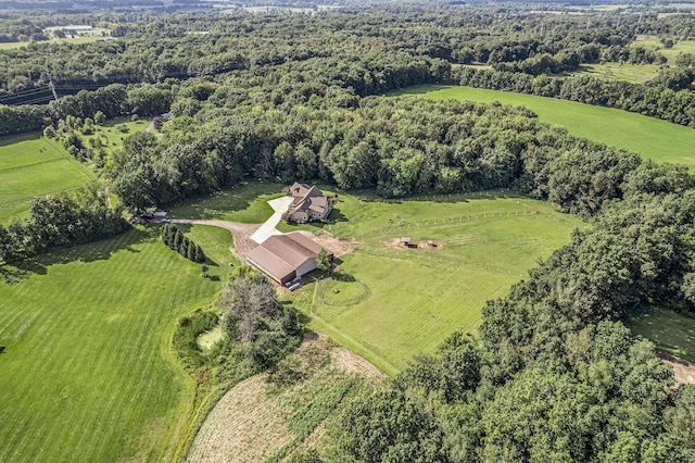 drone / aerial view featuring a forest view and a rural view