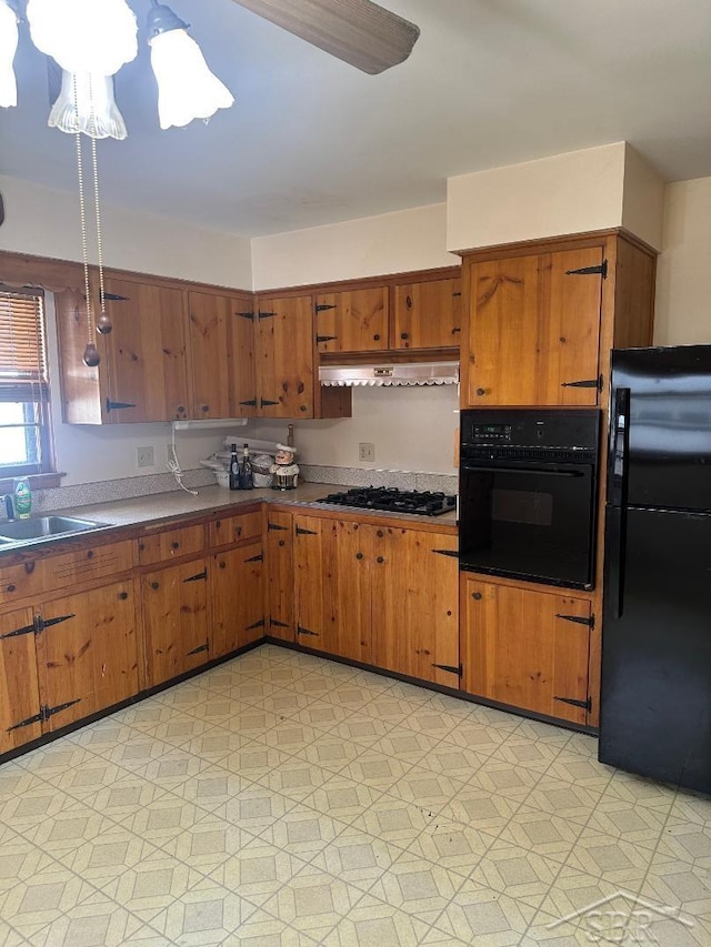 kitchen featuring sink and black appliances