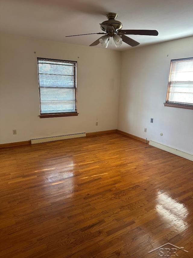 unfurnished room with hardwood / wood-style flooring, a baseboard radiator, and ceiling fan