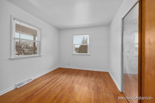 empty room with light wood-type flooring