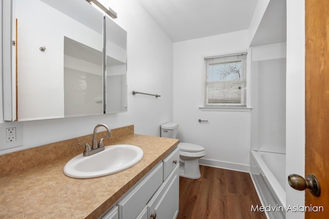 bathroom featuring hardwood / wood-style flooring, vanity, and toilet