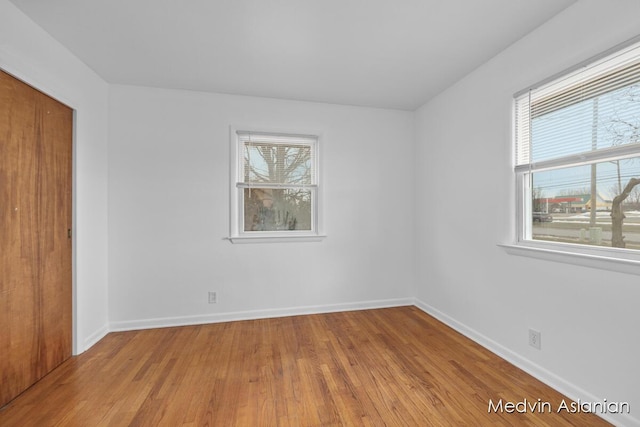 empty room with light wood-type flooring