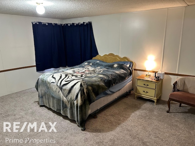 carpeted bedroom with a textured ceiling