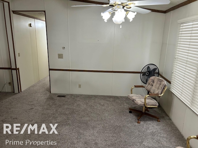 unfurnished room with carpet flooring and ceiling fan