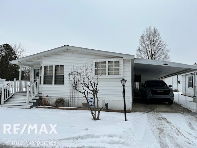 view of front of property with a carport