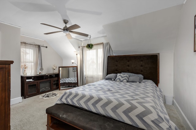 bedroom featuring lofted ceiling, carpet floors, and ceiling fan