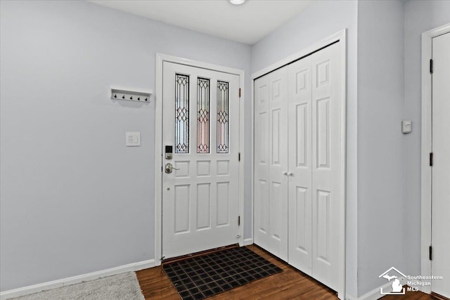 entryway with dark hardwood / wood-style floors