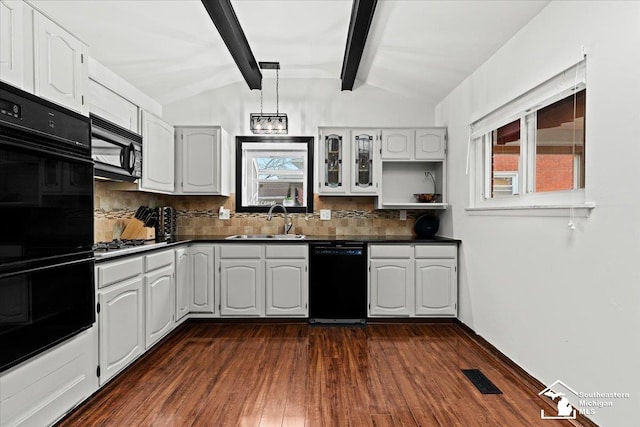 kitchen with lofted ceiling with beams, white cabinetry, tasteful backsplash, sink, and black appliances