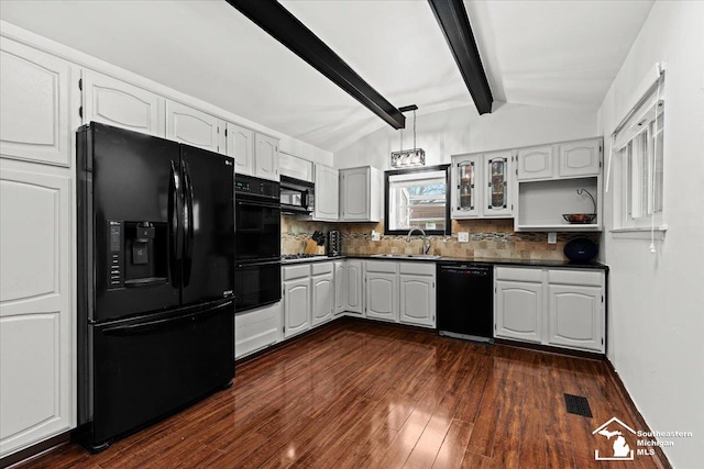 kitchen featuring decorative backsplash, vaulted ceiling with beams, white cabinets, and black appliances