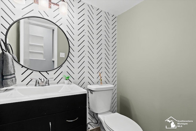 bathroom with vanity and toilet