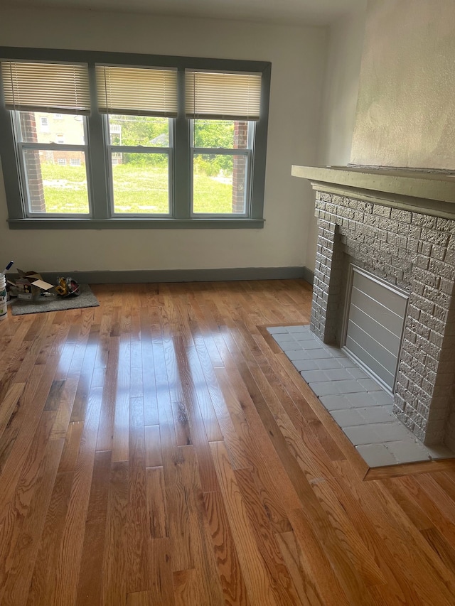 unfurnished living room featuring light wood-type flooring