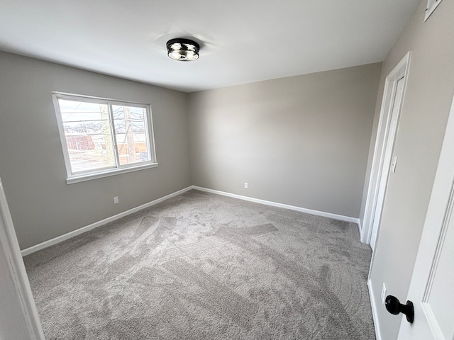 spare room with light carpet