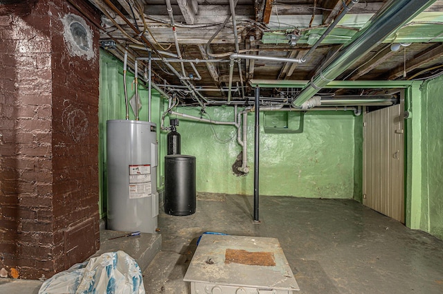 unfinished below grade area featuring water heater