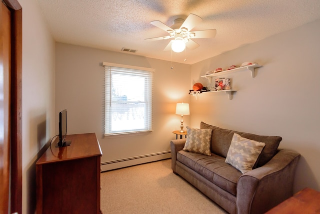 living room with a textured ceiling, light carpet, ceiling fan, and baseboard heating