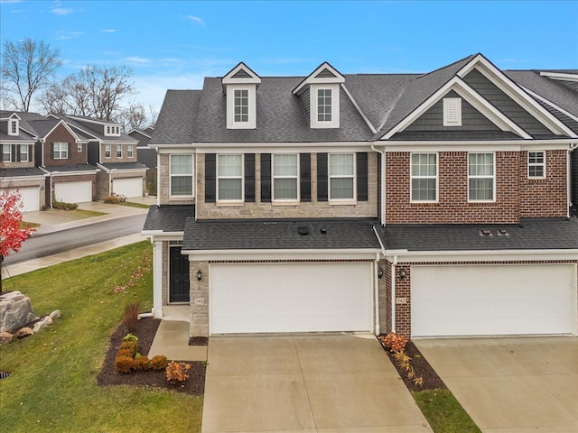 view of property with a garage and a front yard