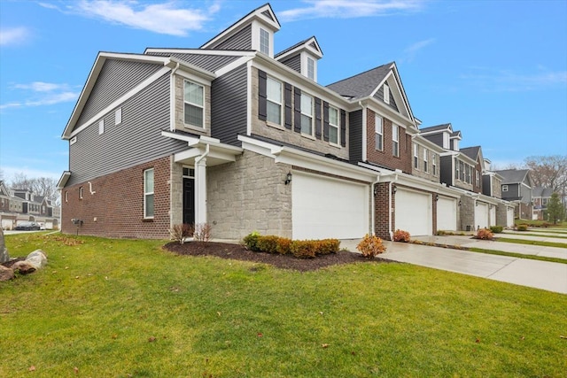 view of front of home featuring a garage and a front lawn