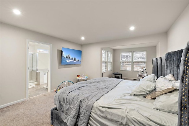 carpeted bedroom with ensuite bath