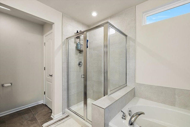 bathroom featuring tile patterned floors and shower with separate bathtub