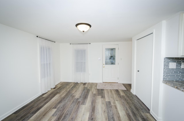 unfurnished room featuring dark hardwood / wood-style floors