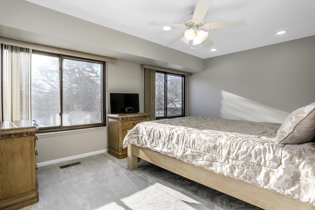 carpeted bedroom with ceiling fan