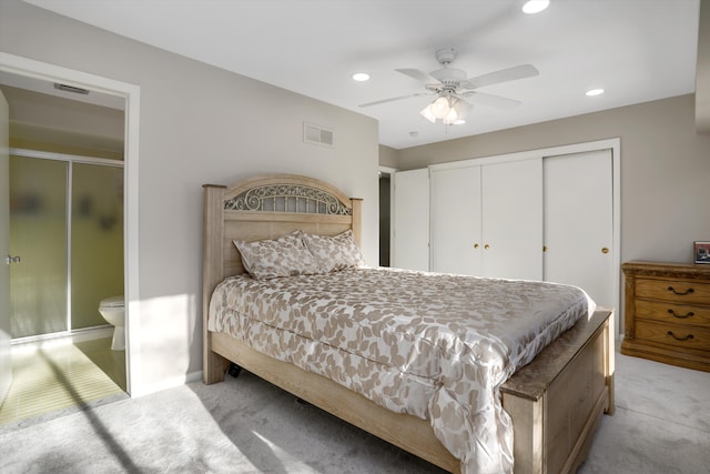 carpeted bedroom with ceiling fan and a closet