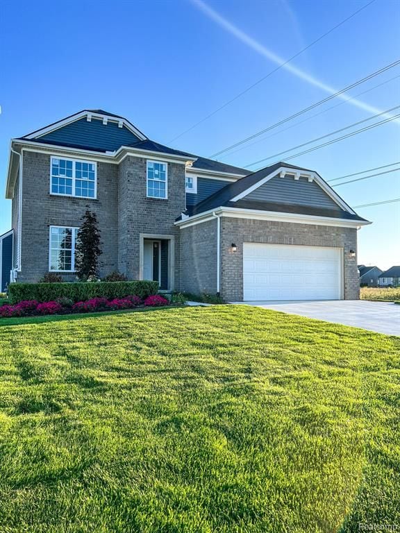 view of front of house featuring a garage and a front lawn