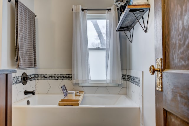 bathroom with a tub to relax in