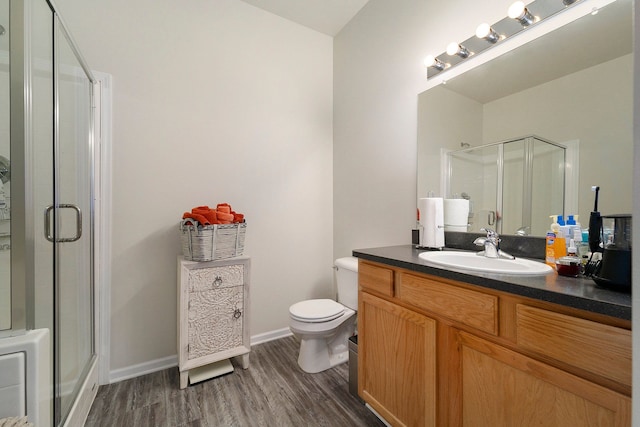 9 Delaware St, Detroit, MI 48202 - bathroom with hardwood / wood-style flooring, vanity, toilet, and an enclosed shower