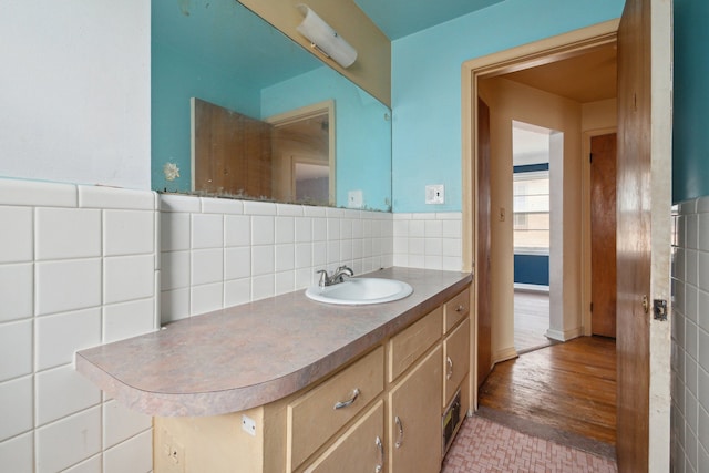 bathroom with tile walls and vanity