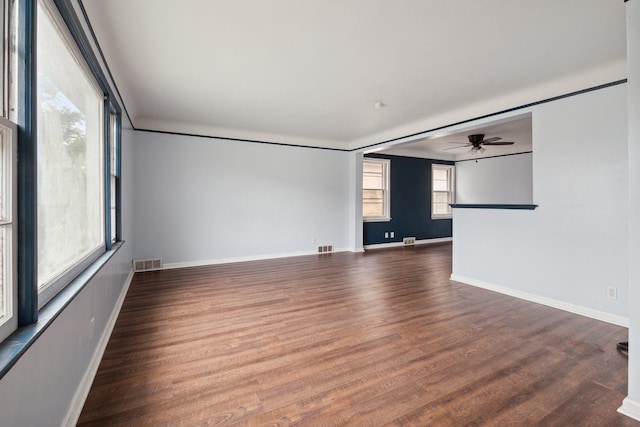 unfurnished room featuring dark hardwood / wood-style floors and ceiling fan