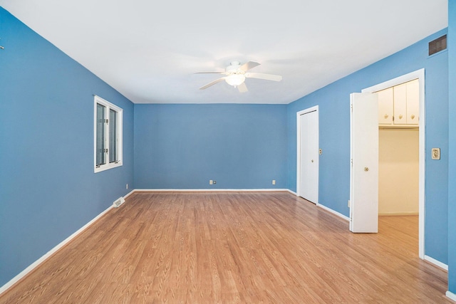 interior space with ceiling fan and light wood-type flooring