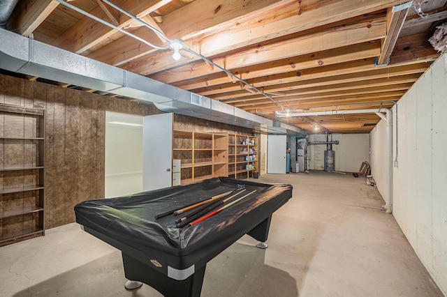 playroom with pool table, gas water heater, and concrete flooring