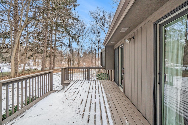 view of snow covered deck