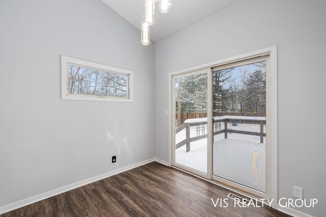 unfurnished room with dark wood-style flooring and baseboards