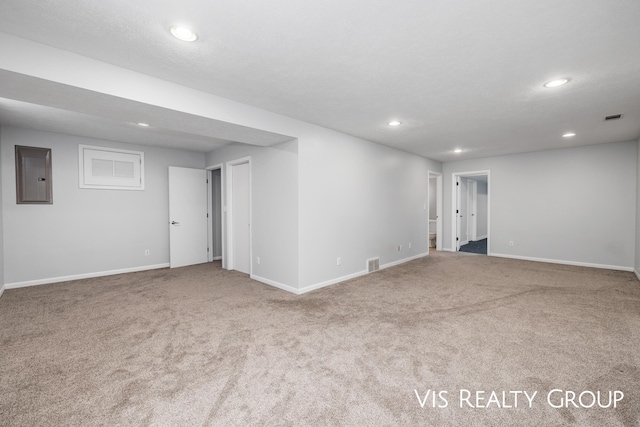 interior space with electric panel, visible vents, carpet flooring, and recessed lighting