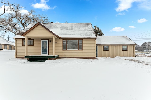 view of snow covered house