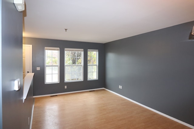 spare room featuring light hardwood / wood-style flooring