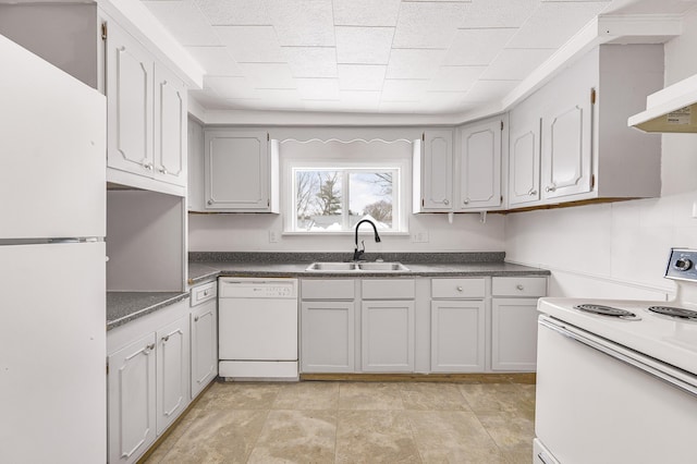 kitchen featuring gray cabinetry, sink, and white appliances