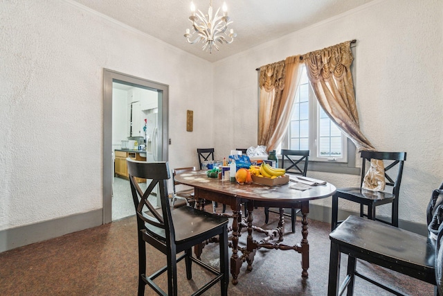 dining room with a notable chandelier and crown molding