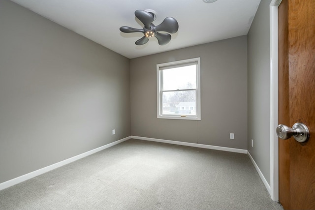 empty room with carpet floors and ceiling fan